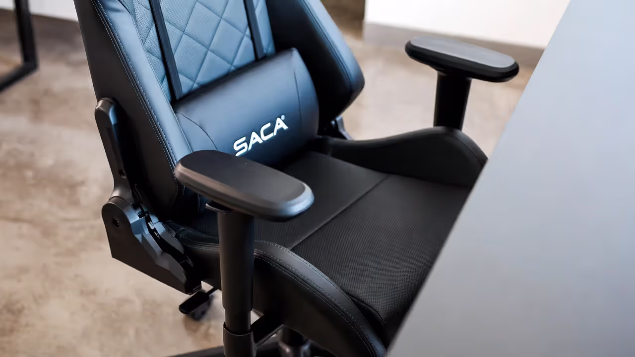 Gaming chair showing adjustable armrests and lumbar support features