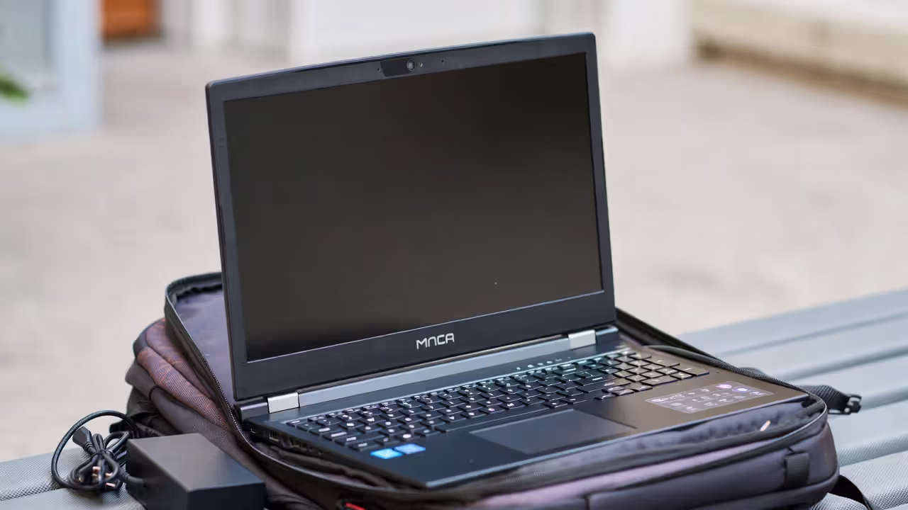 Gaming laptop in a backpack with a charger showing portability trade-offs