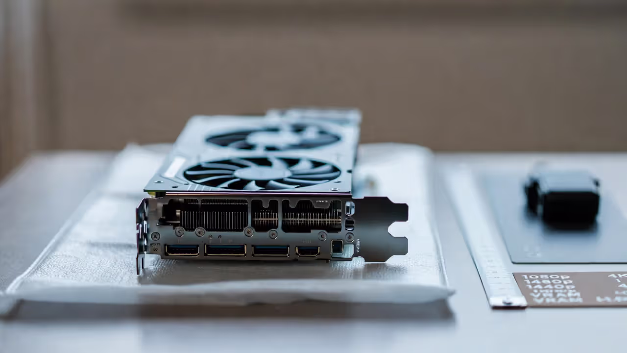 Close-up of a modern graphics card on a desk highlighting gaming performance considerations